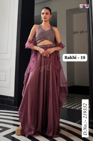 Elegant woman wearing a mauve-purple designer lehenga set with sequin halter top, flowy georgette skirt, and sheer dupatta, posing indoors.